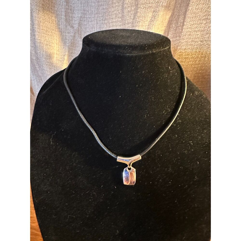 Lia Sophia Silver Tone Pendant with Leather Cord